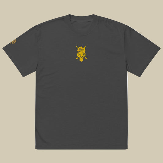 Creative.Era  Ingoma t-shirt — faded black t-shirt with golden drum symbol, artistic Streetwear for creators.